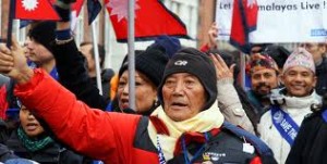 Min Bahadur Serchan with national flag during a programme after his record ascent on 2008. Photo: File photo