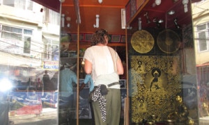 A foreigner observing a shop at Thamel in Kathmandu. Photo: Nepal Mountain Focus. 