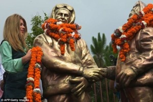 In this photo by AFP, Amelia Rose Hillary, granddaughter of mountaineer Edmund Hillary, offers garlands to the statues of Tenzing and Hillary during the Mount Everest Diamond Jubilee celebrations in Kathmandu, on the occasion of Everest Day on May 29, 2013. Courtesy to AFP.