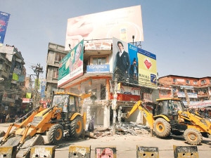 Bulldozers demolishing a house in Chabahil. Photo: ekantipur.com 