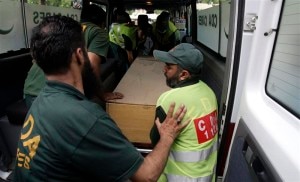 Hospital staff and rescue workers move the body of one of the nine foreign tourists killed by unidentified gunmen near the Nanga Parbat peak, from an ambulance to a hospital morgue in Islamabad. REUTERS