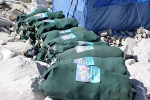 Bags of garbage collected by the team sit at a base camp along the trail. Over 4,000kg of garbage was collected. Photo: Courtesy of Nepal Army