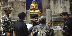 Security personnel inspecting the shrine where a terrorist group planted 9 bombs. Photo: Agency