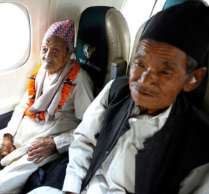 Elderly Bote Rai (left ), 106, sits in the window seat accompanied by his nephew Man Bahadur Rai who is himself 75 years old, in his unique journey of a Yeti Airlines aircraft. Photo: Yeti Air 