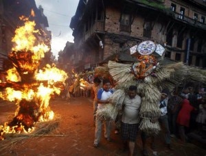 Devotees watch as a straw effigy of Ghanta Karna burns during celebrations of Hindu festival of Gathemangal, in Bhaktapur. Photo: Nepal Mountain Focus
