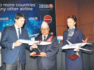 Official of Turkish Airline handing over the airplane to the Director general of the Civil Aviation Authority of Nepal Ratish Chandra Lal Suman during inauguration of flights of the airline in Nepal on Monday, September 02, 2013. 