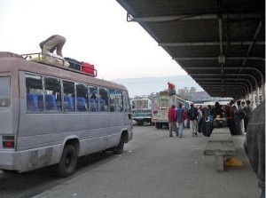 A staff manage the belongings of passengers on the hoot of the bus at New Bus Park in Kathmandu. With the festive season approaching rush at the bus park that connect all most all the Nepal districts with capital city is seen. Photo: File photo