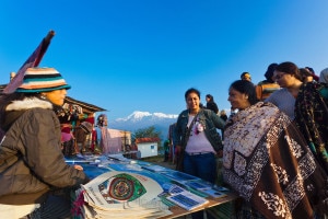 A group of Indian tourists bargaining  with a local vendor at Sarangkot, a popular tourist destinations for Sunrise and Sunset views at Pokhara. Photo: File photo  