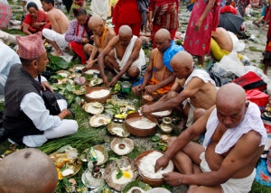 In this file photo Hindu devotees are seen performing Shraddha rituals at the bank of Bagmati River in Kathmandu. Nepali Hindus perform anniversary rituals in memory of their departed ancestors on the very date of their death as per the lunar calendar. Photo: AP