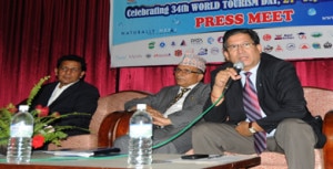 Acting CEO of NTB Subash Niraula responds the question as Sushil Ghimire, Secretary at Ministry of Culture, Tourism and Civil Aviation looks during the press meet organized to unveil World Tourism Day programmes in Kathmandu. 