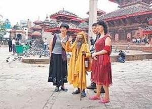 Chinese tourists taking photo with a holy sage in the Kathmandu Durbar Square. Photo: File photo