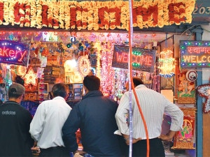 Buyers checking for electric lamps for Tihar at a shop in Mahabouddha, Kathmandu. Photo: NMF