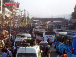 People and buses at Kalanki, the main departure point in Kathmandu. Bus park areas and the exit points are overcrowded with large number of people leaving Kathmandu to their home for Dashain.