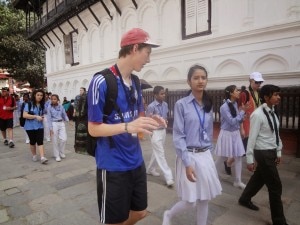 Foreign tourist interacts with a student during their visit to the Hanuman Dhoka Palace Museum in Kathmandu Durbar Square, Basantapur, Kathmandu. Photo: NMF