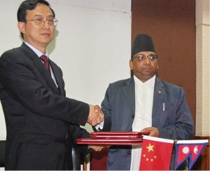 Finance Secretary Shanta Raj Subedi (right) shaking hands with ambassador of China to Nepal Wu Chuntai after exchanging signed documents at the ministry in Kathmandu on Thursday, Nov. 28. 
