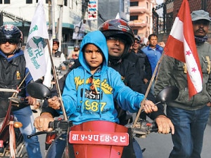 Minor being used at a poll campaign in Kathmandu. Photo credit to facebook.