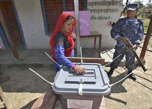 Woman casting a vote in second CA polls held on November 19.