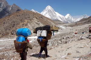 Porters carrying loads to the Everest Base Camp. Photo: alanarnette.com