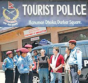 Foreign tourists inquiring about the situation with tourists police at Basantapur Durbar Square in Hanuman Dhoka, Kathmandu. Photo: File photo/NMF