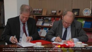 Ambassador of Norway to Nepal Kjell Tormod Pettersen (left)and Dr David Molden of ICIMOD signing the deal