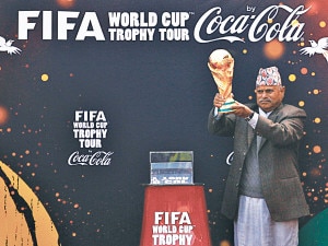 President Ram Baran Yadav holds the Fifa World Cup trophy at the Dashrath Stadium in Kathmandu on Saturday. 