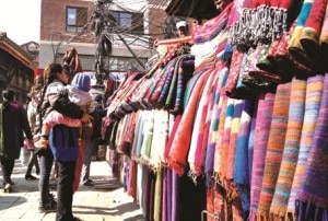 A woman looks for the shawls being put for selling at Indrachowk, the central marketplace in Kathmandu. With the  onset of winter mercury of Kathmandu has also dipped. Photo: NMF