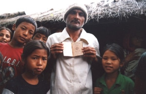 A Bhutanese refugee showing his identity. Photo courtesy to wikipedia.