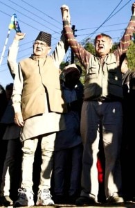 Acting CA Chairman Surya Bahadur Thapa (l) with his son Sunil during the CA election campaign in November 2013. Photo: File Photo