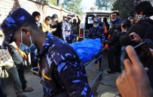 Security personnel bring in the victims of the crash to TU Teaching Hospital in Kathmandu on Monday for autopsy. Photo: nepalnews.com