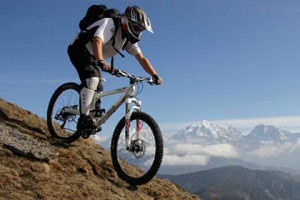 A foreigner enjoys mountain biking at tourist hub city Pokhara, located at western province in Nepal. File Photo:www.turrettours.com.