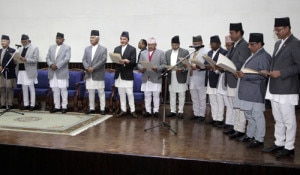 Prime Minister Sushil Koirala (second from left) administers the oath ofoffice to the new Minister in the presence of the President Dr.  Ram Baran Yadav, Tuesday. Photo: Rabi Maharjhan
