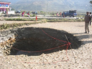 A sink hole formed in the field. Photo: ekantipur.com