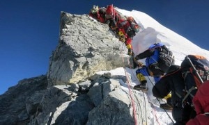 In this image released by mountain guide Adrian Ballinger of Alpenglow Expeditions and taken Saturday, May 18, 2013, climbers navigate the Hillary Step just below the summit of Mount Everest, in the Khumbu region of the Nepal Himalayas. -AP Photo.