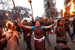 Nepalese student activists participate in a torch to protest petroleum price hikes. File photo: framework.latimes.com