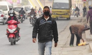 The sight of Kathmandu residents wearing masks is an increasingly common sight. Photograph: Sara Germain/Gurdain.co.uk