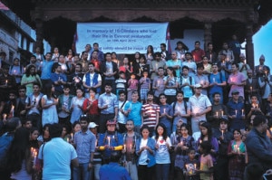 People holding candles gather at Basantapur, Kathmandu on Wednesday to observe the 13th day of the deaths of 13 people in an avalanche on Everest.