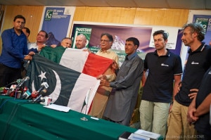 Pakistan and italian flags. On the right the-alpinists Cucchi Origone Taqi