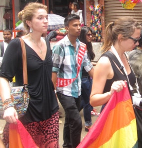 In this file photo taken a year ago two women tourist seem walking acrossing the streets in the capital Kathmandu, Nepal. Image source: NMF/file.