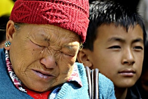 In this handout file photograph received from RSS (National News Agency) on April 19, 2014, the mother of Mount Everest avalanche victim Ang Kazi Sherpa weeps as she waits for the body of her son to arrive at Sherpa Monastery in Kathmandu. 