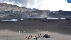 Cricketers attempt a record breaking match played at 5,730 metres (18,910 feet), in the flat crater just below Kilimanjaro's summit (AFP/Peter Martell)