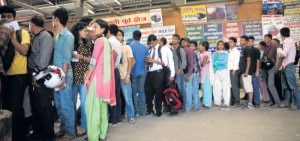 People stand close to counter to get bus tickets. Image: republica.