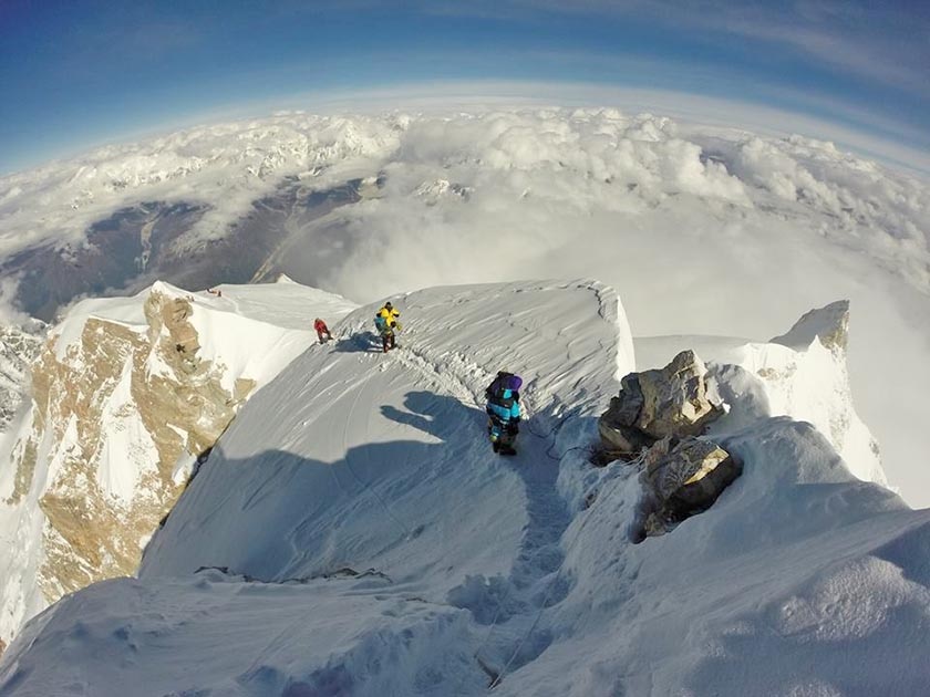 Mountaineers are seen on the summit of Mt Manaslu. Photo Courtesy: Mingma Sherpa