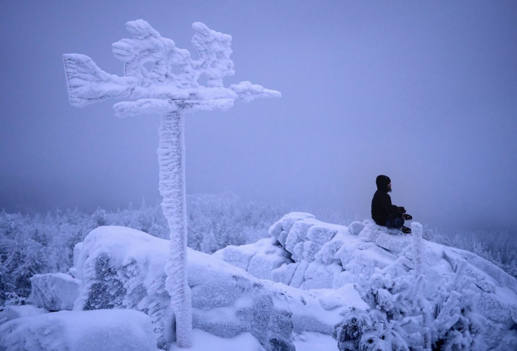 Buddhist novice pay their respects at the monastery