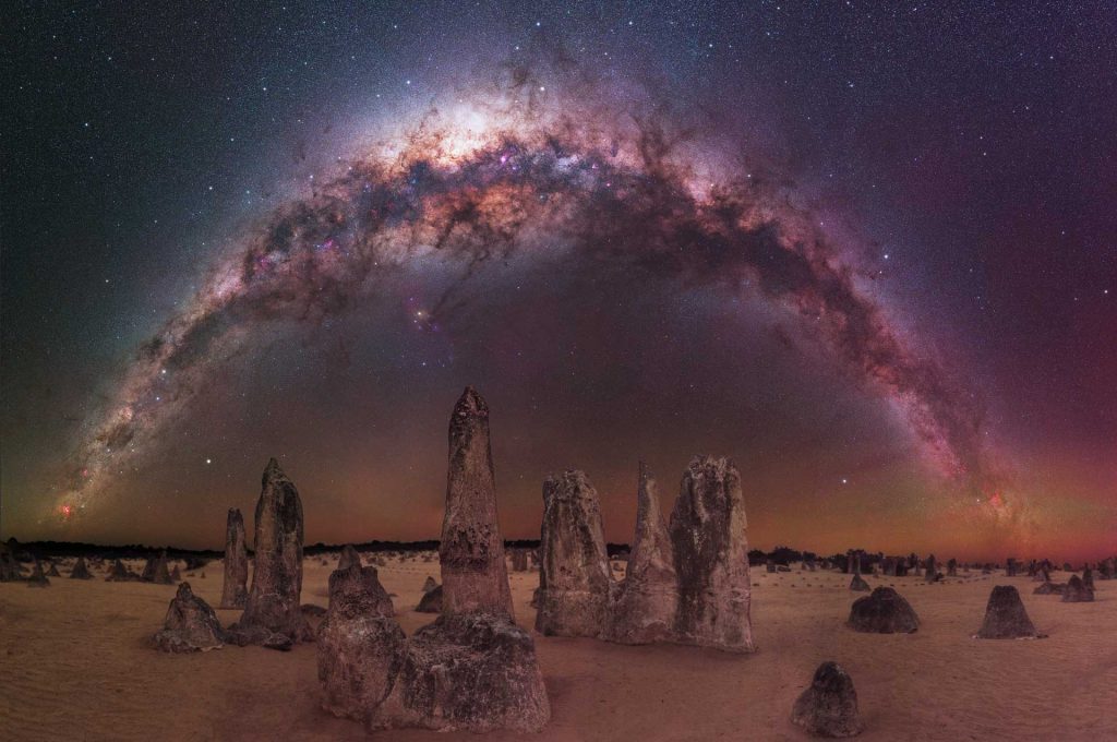 “The Milky Way arching over The Pinnacles Desert” – Trevor Dobson. Nambung National Park, Australia