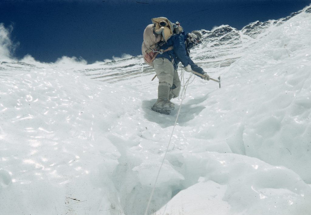 Tenzing Norgay wearing crampons climbing down an icy patch on the Lhotse Face, Nepal, March 1953. Mount Everest Expedition 1953.  (Photo by George Lowe/Royal Geographical Society via Getty Images)